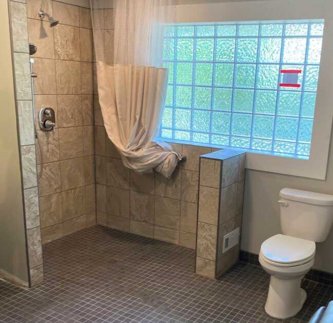 bathroom-remodeling-contractor Functional and visually-appealing ADA bathroom with accessible shower and toilet.